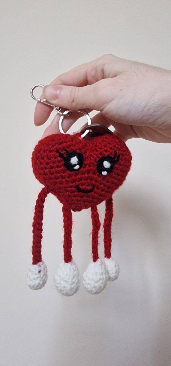 Handmade crochet heart keychain with moving arms and legs