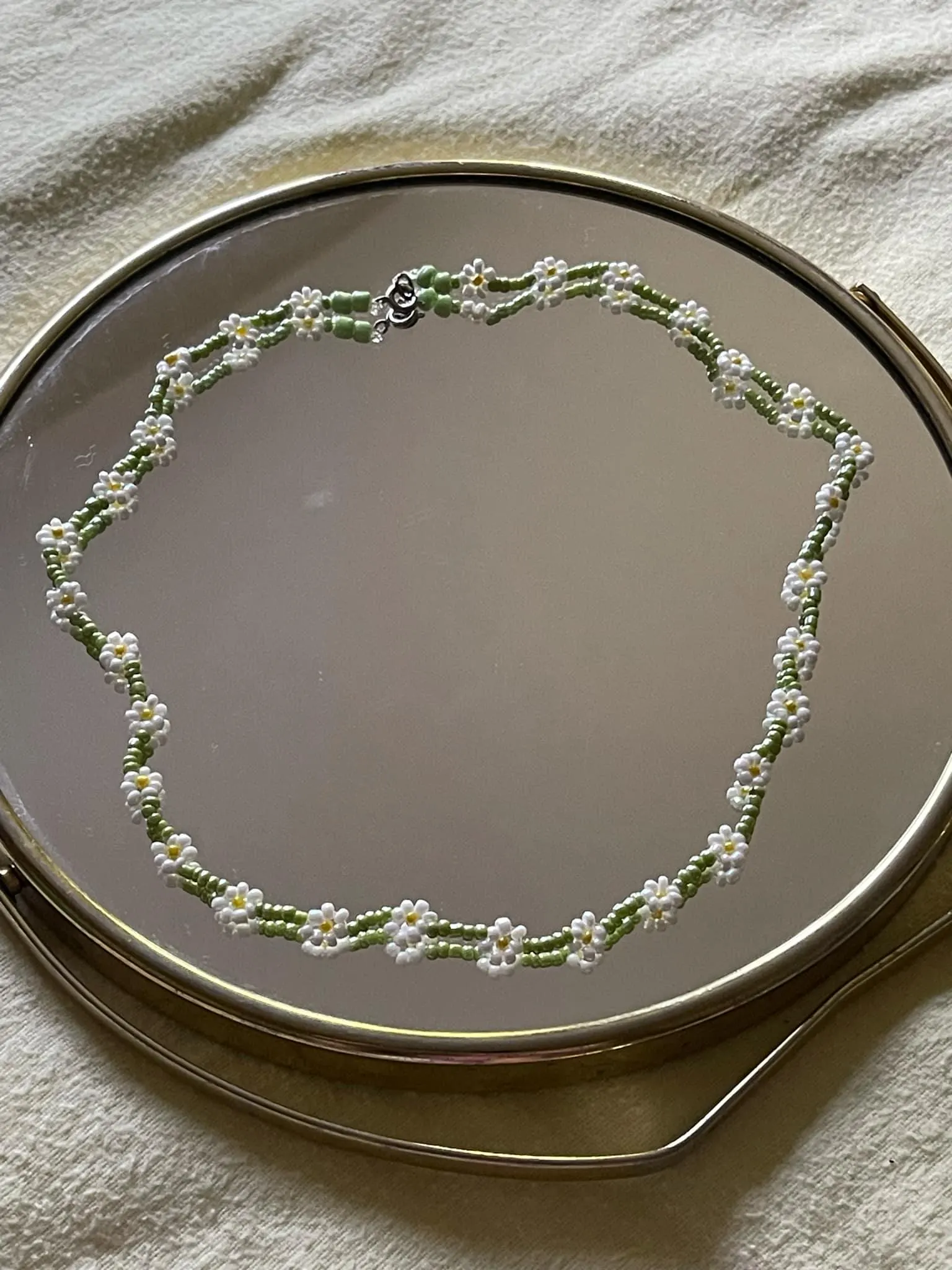 Handmade daisy beaded necklace in white and green floral design